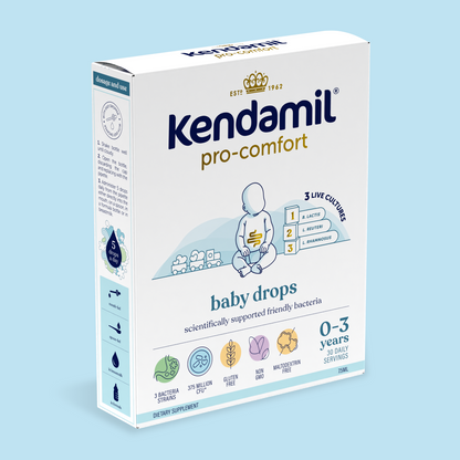 Box of Pro-Comfort Baby Drops by Kendamil, designed for ages 0-3, containing 3 live probiotic cultures to support the gut microbiome, with 30 daily servings. Packaging features a blue baby illustration and product details on a light blue background.