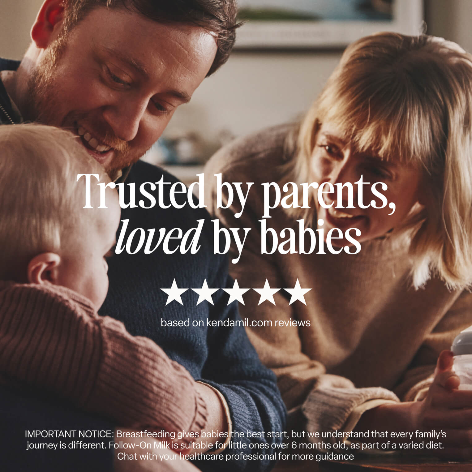 A smiling man and woman interact lovingly with a baby indoors. Text reads, Trusted by parents, loved by babies, with five stars and a note about reviews on Kendamil.com. Featuring our Classic Follow-On Milk made with whole milk and enriched with plant-based DHA; a breastfeeding and follow-on milk disclaimer appears below.