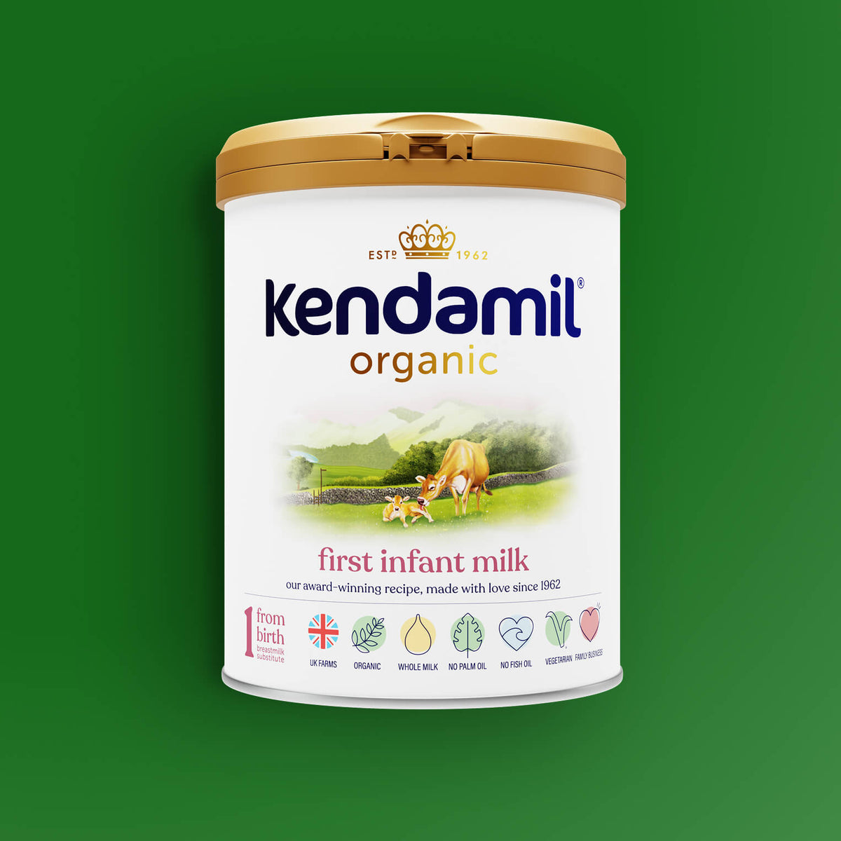A can of Organic First Infant Milk on a green background, featuring a gold lid, a cow illustration, and icons highlighting its benefits such as being an organic whole milk formula made from grass-fed cows and suitable for use from birth.