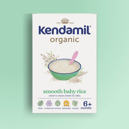 A 7-Pack of Organic Baby Rice (6+ months) for babies, featuring a green bowl with rice and a pink spoon, plus icons indicating organic, no added sugar, high-quality grains, award-winning, and vegetarian.